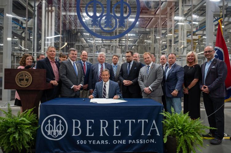 Gov. Bill Lee, surrounded by state lawmakers at Beretta USA's Tennessee campus, signs the so-called constitutional carry legislation. June 2, 2021.