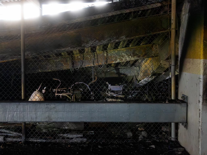 gas tanks behind fence.png