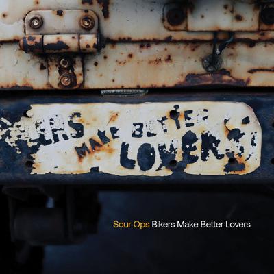 Cover art for Sour Ops’ ‘Bikers Make Better Lovers’, the Nashville Scene’s 2026 Writers’ Choice for Best Power-Pop Album, featuring a photo of the title phrase on a sticker that’s wearing off a rusty bumper