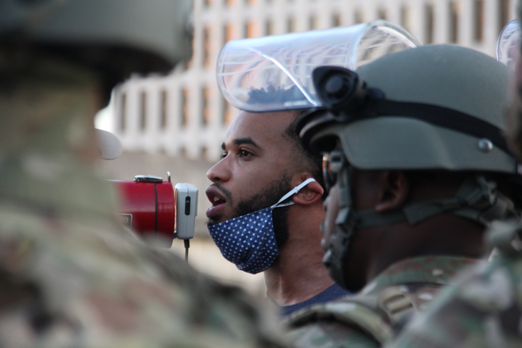 Peaceful Protesters Sing, Chant to Mass of National Guard Members