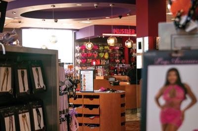 Shelves of tights and costumes at Hustler Hollywood