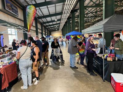 Rainbow decorations and accessories adorn stalls, vendors and customers at BoroPride