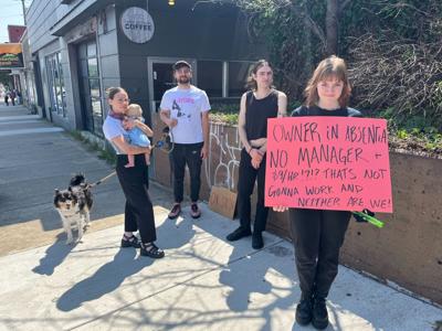 Employees strike outside Three Brothers Coffee Tuesday morning