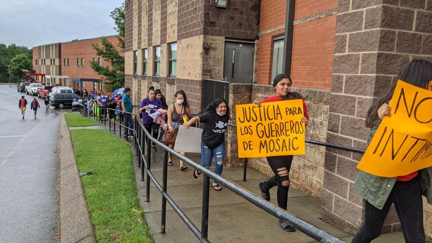 Tenants with signs enter Glenview Elementary227308.jpg