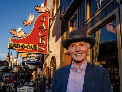 Jack Cawthon poses outside of his downtown Jack's location on its final day of operation, 2025