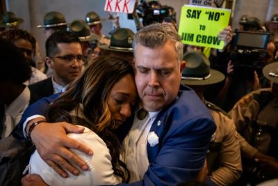 Rep. Jason Powell (D-Nashville) hugs a tearful Sen. London Lamar (D-Memphis) in the state Capitol, May 7, 2026.