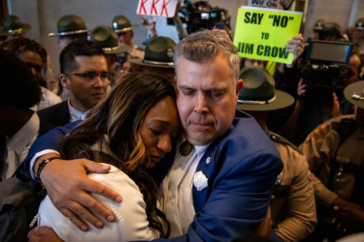 Rep. Jason Powell (D-Nashville) hugs a tearful Sen. London Lamar (D-Memphis) in the state Capitol, May 7, 2026.