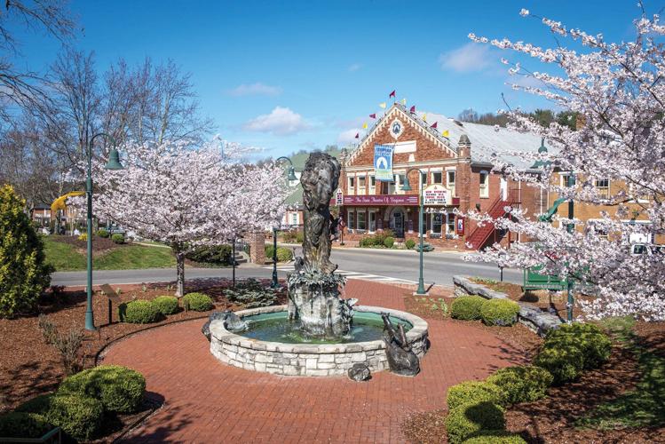 Exterior shot of the Barter Theatre and nearby statue and fountain