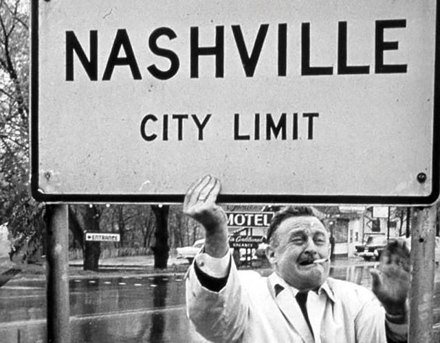 Mayor Beverly Briley holding up the Nashville City Limit Sign