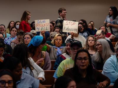 Community members protest ICE stops at a special-called meeting of the Metro Council’s Public Health and Safety Committee, May 7