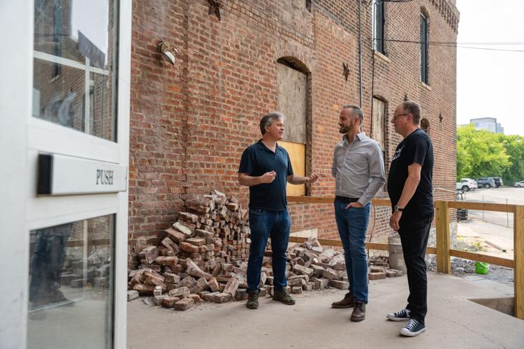 Zach Liff, Brent Hyams and Ray Waters at the entrance to Cannery Hall.jpg