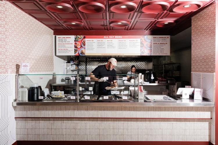 Inside Golden Prawn #3 staff prepares an order