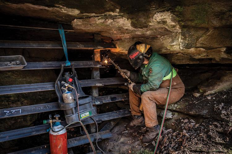 Lydia Hernandez welds a bat cave gate in Middle Tennessee