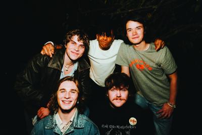 Band photo featuring the actors-slash-musicians who are both the members of the band The Runarounds and the cast of the eponymous show on Amazon Prime Video.