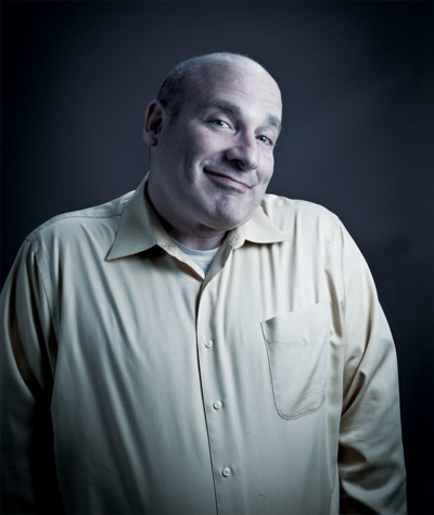 Brad Schmitt, the city’s once notorious celebrity columnist, re-enters the public eye — for all the right reasons