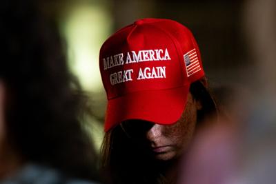 An MTSU student in a "Make America Great Again" hat attends a Charlie Kirk vigil in Murfreesboro, September 2025