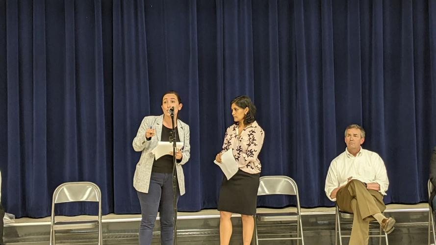 A translator relays a message from Bond Companies' lawyer. Rob Bond is seated to the right.