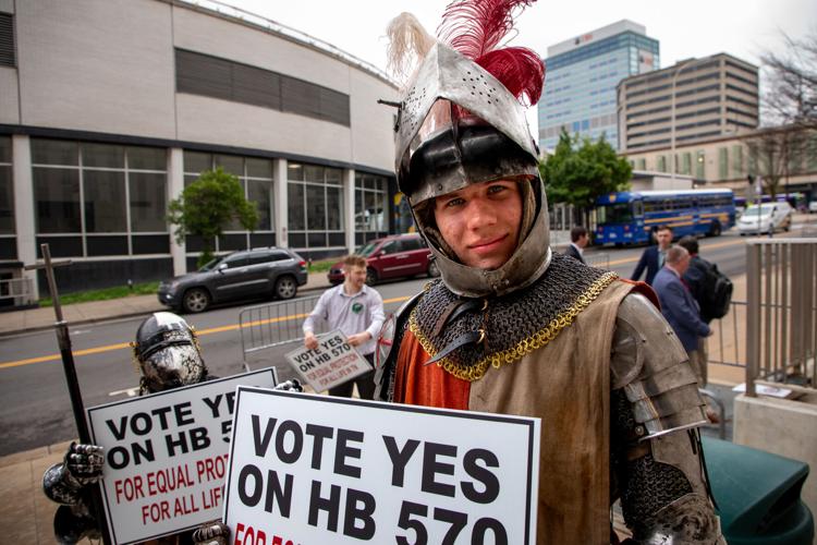 Brothers Justice (right) and Joseph Breton wear armor as they demonstrate outside of the Cordell Hull State Office Building in support of HB507, March 10, 2026