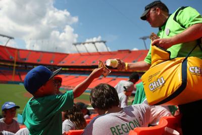 Fans buy a frozen lemonade at Sun Life Stadium in Miami Gardens, Fla., July 2011