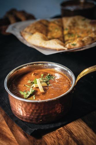 Lamb achari and garlic naan