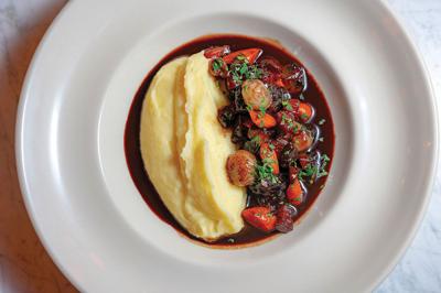 A savory plate of food at Pastis