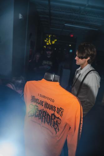 Handing out the commemorative pre-ordered T-shirts at the Belcourt for the 15th annual horror movie marathon 12 Hours of Terror, 10/17/2026.