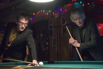 Paul Burch and Fats Kaplin play billiards in a promo photo.