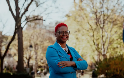 Monica Meeks posing outdoors in a blue blazer