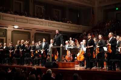 Musicians standing onstage with the Nashville Symphony, the Nashville Scene’s 2026 Best Performing Arts Group in Nashville