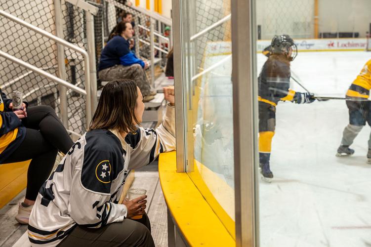 Supporters cheer at a Nashville Women's Ice Hockey game