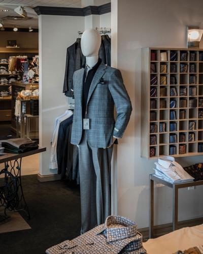 A mannequin and suits and ties for sale at Levy's