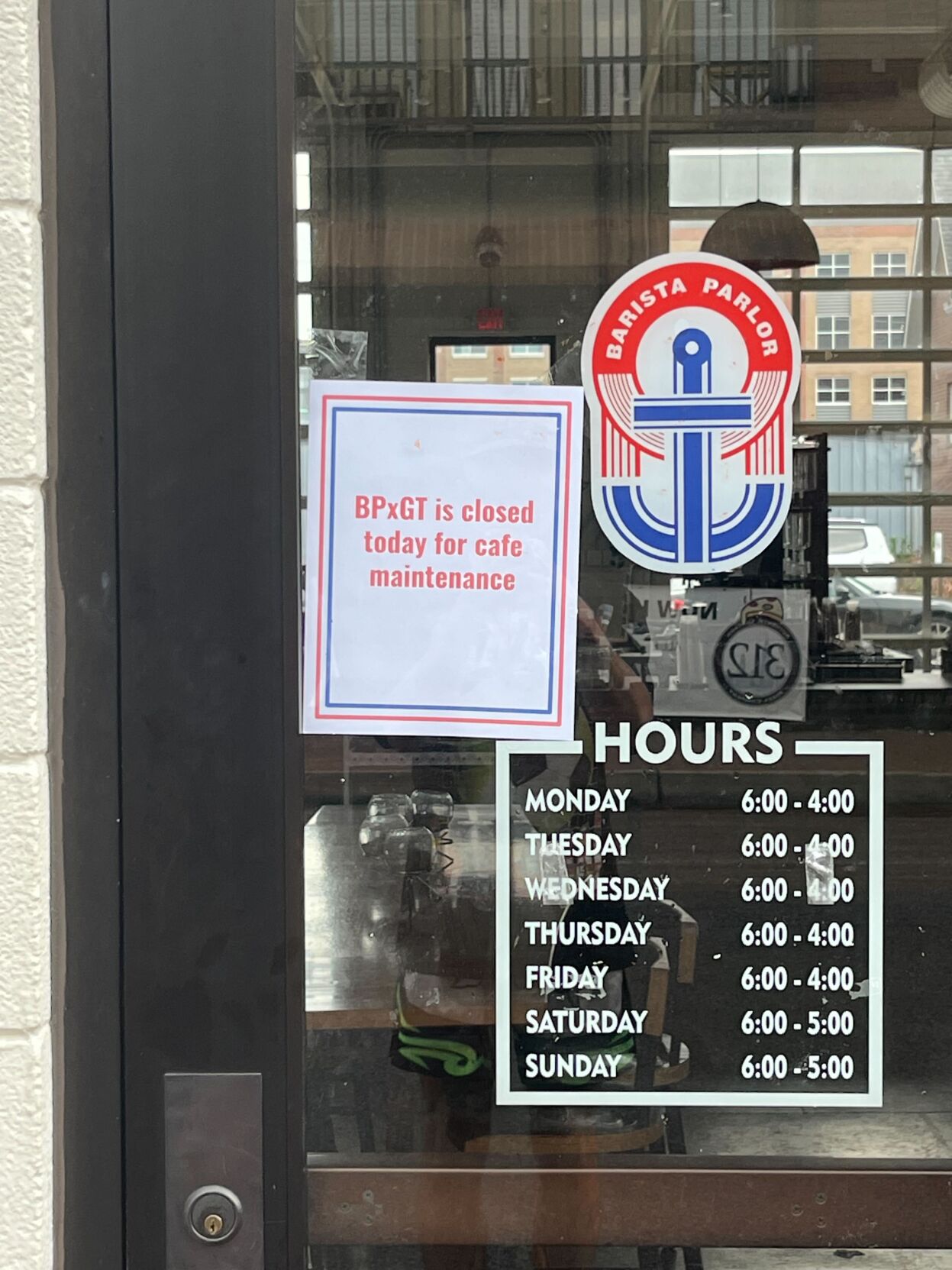 A sign outside the Germantown Barista Parlor says the store is closed for maintenance