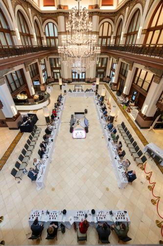 Four long tables for a square in the marble lobby of a hotel
