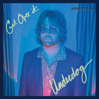 Cover art of Aaron Lee Tasjan’s ‘Get Over It, Underdog,’ features a photo of the artist wearing sunglasses and looking into the camera. It’s the Nashville Scene’s 2026 writers’ choice for Best Album in Nashville