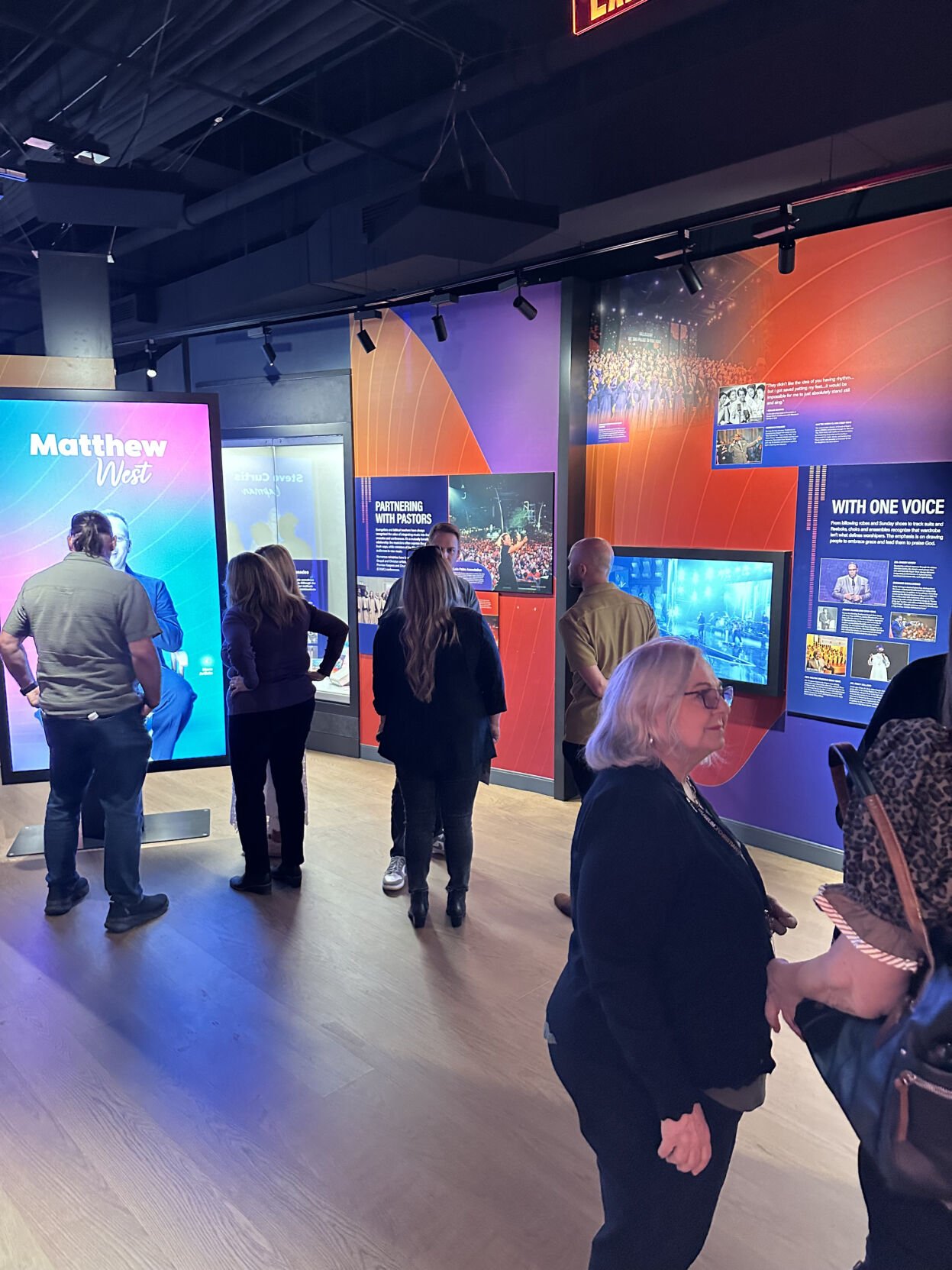 Interior Museum of Christian and Gospel Music patrons examine touch screens at the Matthew West display.jpg