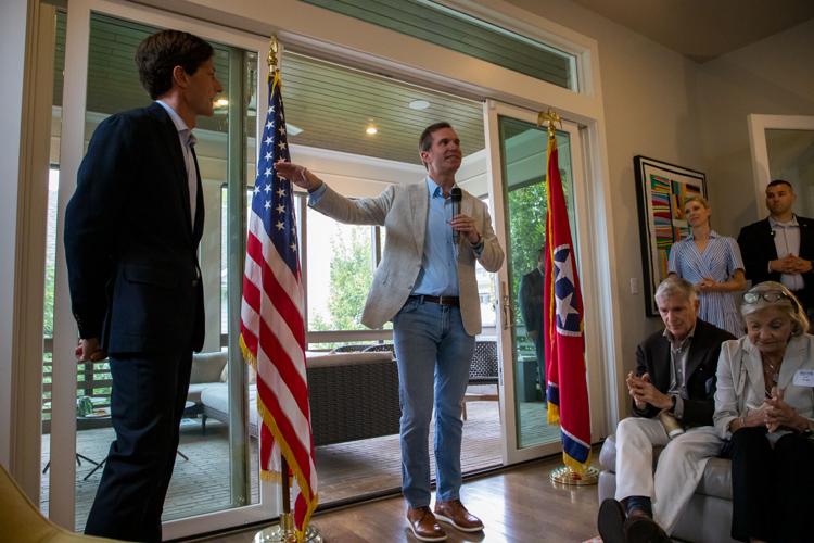 Gov. Andy Beshear (center) speaks at a fundraising event in Nashville, Oct. 3, 2026