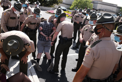 Protesters Accuse State Troopers of Unnecessary Force