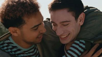 Archie Madekwe and Théodore Pellerin embrace in 'Lurker'