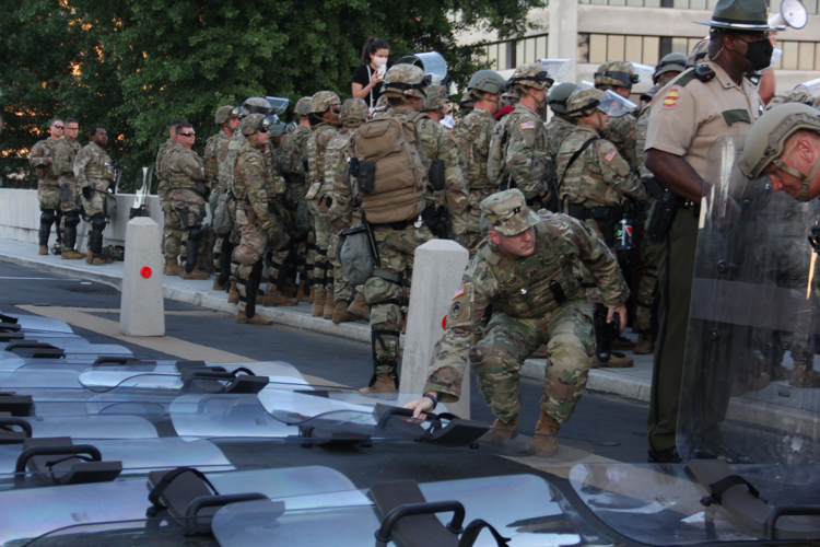 Peaceful Protesters Sing, Chant to Mass of National Guard Members