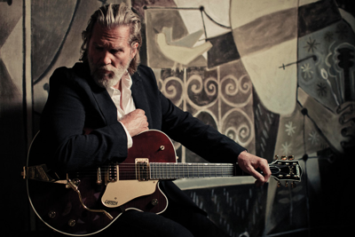 Backed by his band The Abiders, Jeff Bridges isn't just playing musician