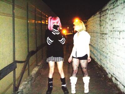 Total Wife press photo Luna Kupper and Ash Richter stand in a hallway