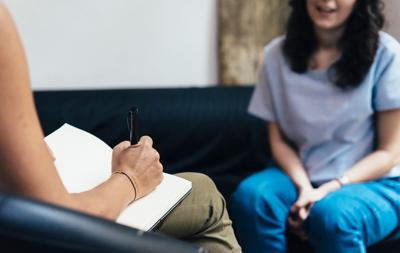 Image of a counselor talking to a student