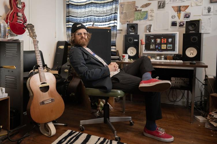 Color photo of Nashville musician Eagle Johnson, seated at the computer in his home music studio that serves as the nerve center for his startup music streamer Juniper