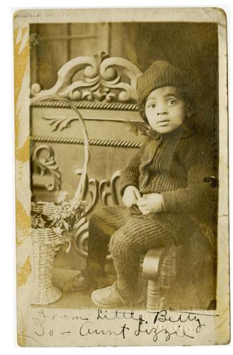 Old ambrotype photo of a young girl with "Little Betty" scribbled near the bottom