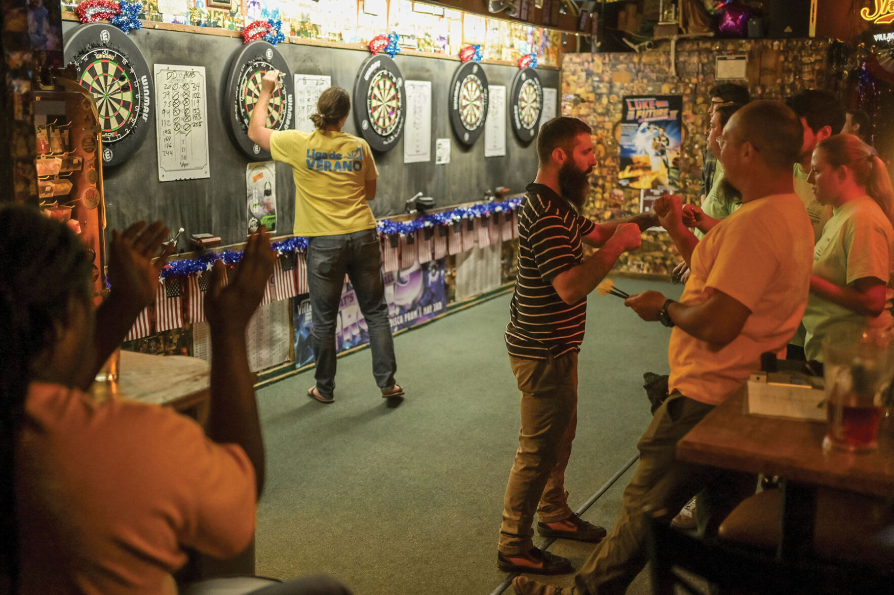 Playing darts at the Villager Tavern