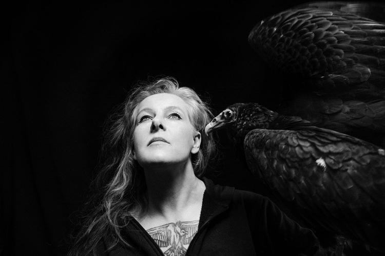 Black and white photo of Neko Case, looking upward over the camera