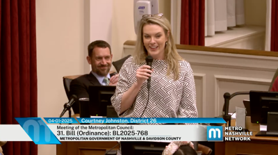 Councilmember Courtney Johnston addresses the Metro Council, while Councilmember Jason Spain looks on