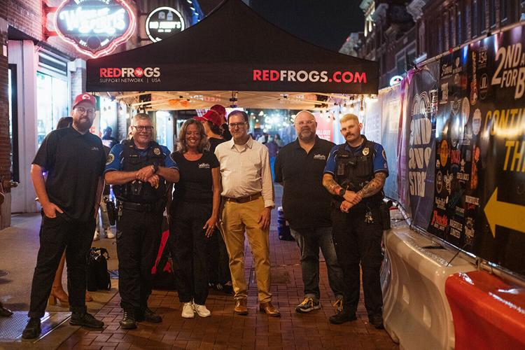 Red Frogs representatives pose with Nashville's night mayor Benton McDonough (center) in downtown Nashville, September 2024