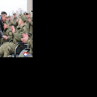 A picture released from North Korea's official Korean Central News Agency (KCNA) showing North Korean leader Kim Jong Un welcoming soldiers