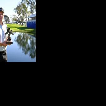 Justin Rose of England poses with the trophy after winning the PGA Farmers Insurance Open